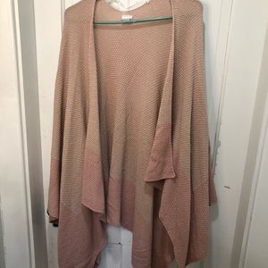 Ombré pink throw over sweater